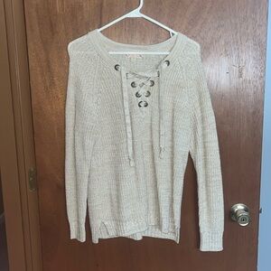 Tan sweater with lacing detail